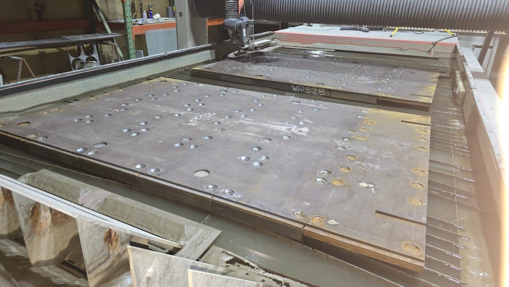 A full sheet nested with parts on the Osborne Park waterjet