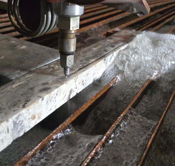 Stone slab being waterjet cut